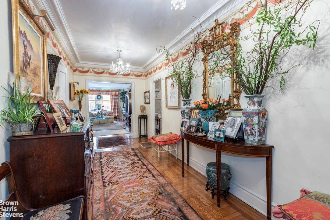 With gracious prewar elegance, this sprawling 8 room apartment boasts southern facing living room and master bedroom, with architectural details hi ceiling and a wood burning fireplace.
