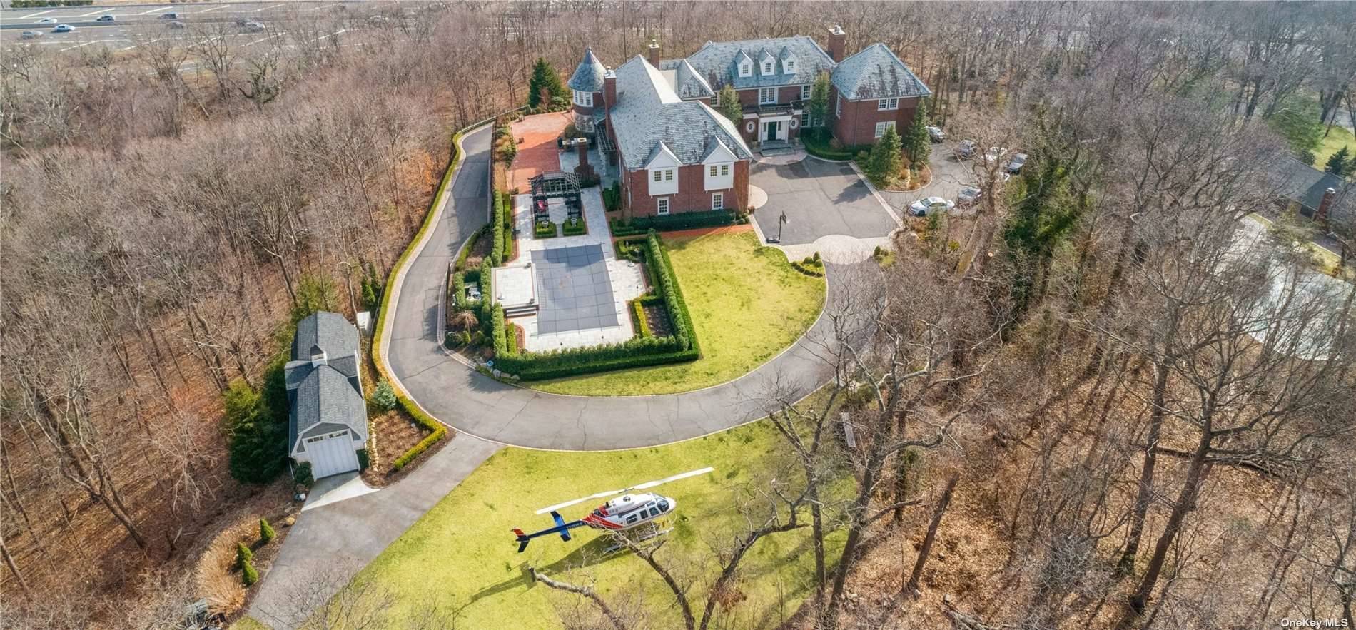 Melville. This majestic brick, 6 bedroom, 6 bath, 3 powder room home sits high up on a hill overlooking all of Long Island with its own, FAA recognized, heliport.