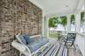 Covered Porch Located off the Primary Bedroom Suite. A Quiet retreat with beautiful waterviews