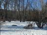 View of yard covered in snow