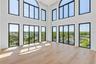 Soaring ceilings in the two-story Living Room