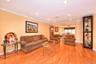 Living room featuring ornamental molding and light hardwood / wood-style floors