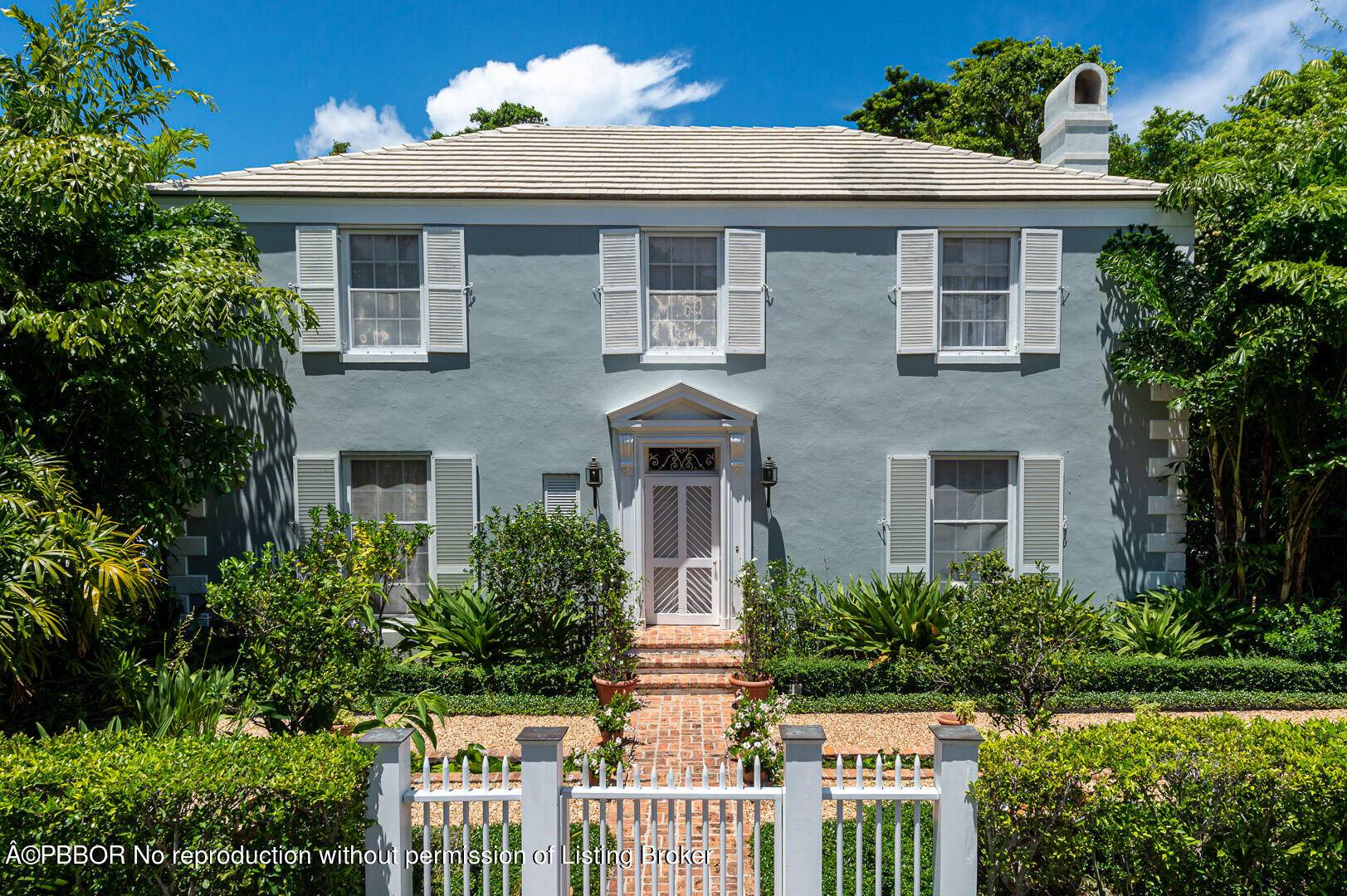 Lovely traditional Palm Beach home with timeless appeal.