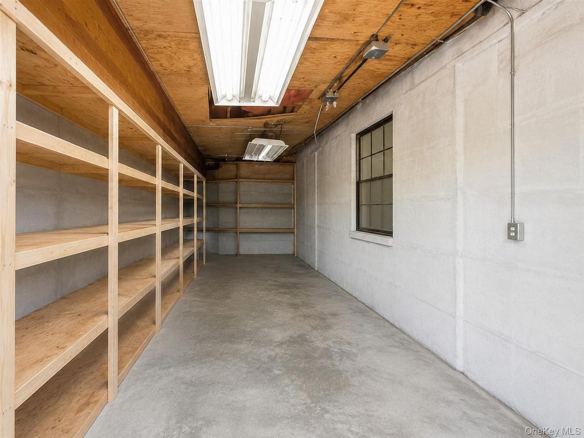Photo has been digitally enhanced to remove stored items and illustrate the available storage space