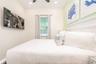 Light and airy bedroom with resort style decor in Margaritaville Orlando investment property