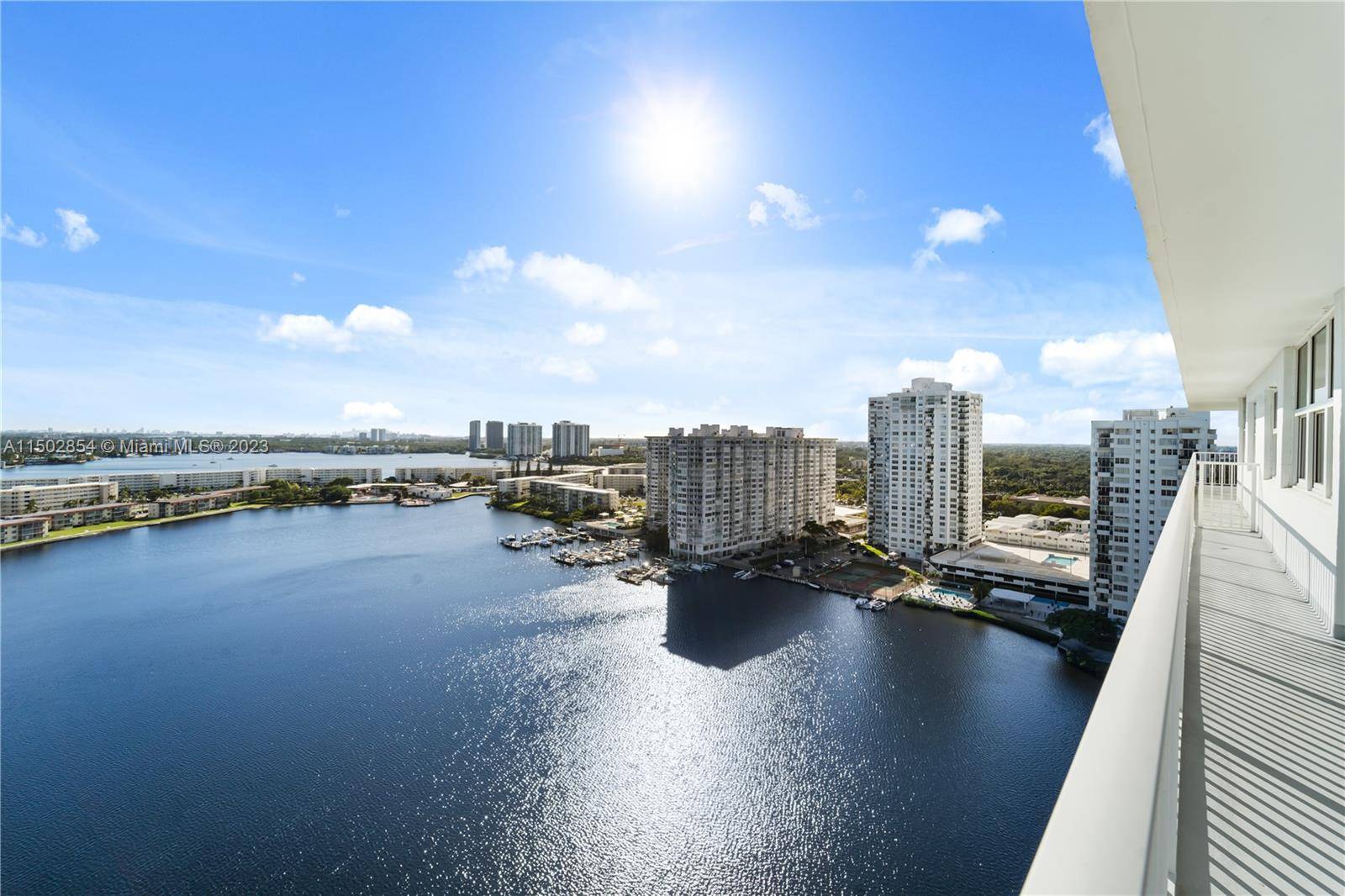 This impeccably renovated corner 2 Bed, 2 Bath residence in Aventura's Admirals Port presents wide breathtaking views of Maule Lake, the Intracoastal Waterway and the Skyline.