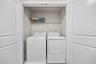 washer and dryer closet in game room loft on second floor