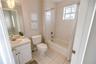 Third floor guest suite with spacious closets and a serene ensuite bath.