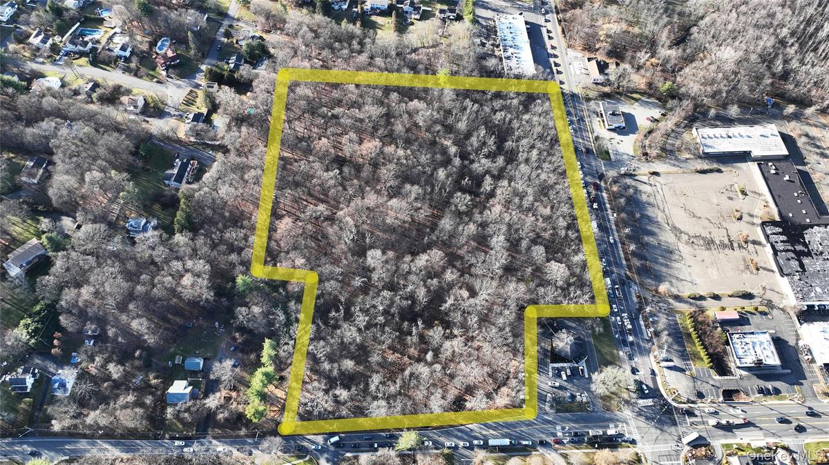 Aerial overview of property's location featuring property parcel outlined