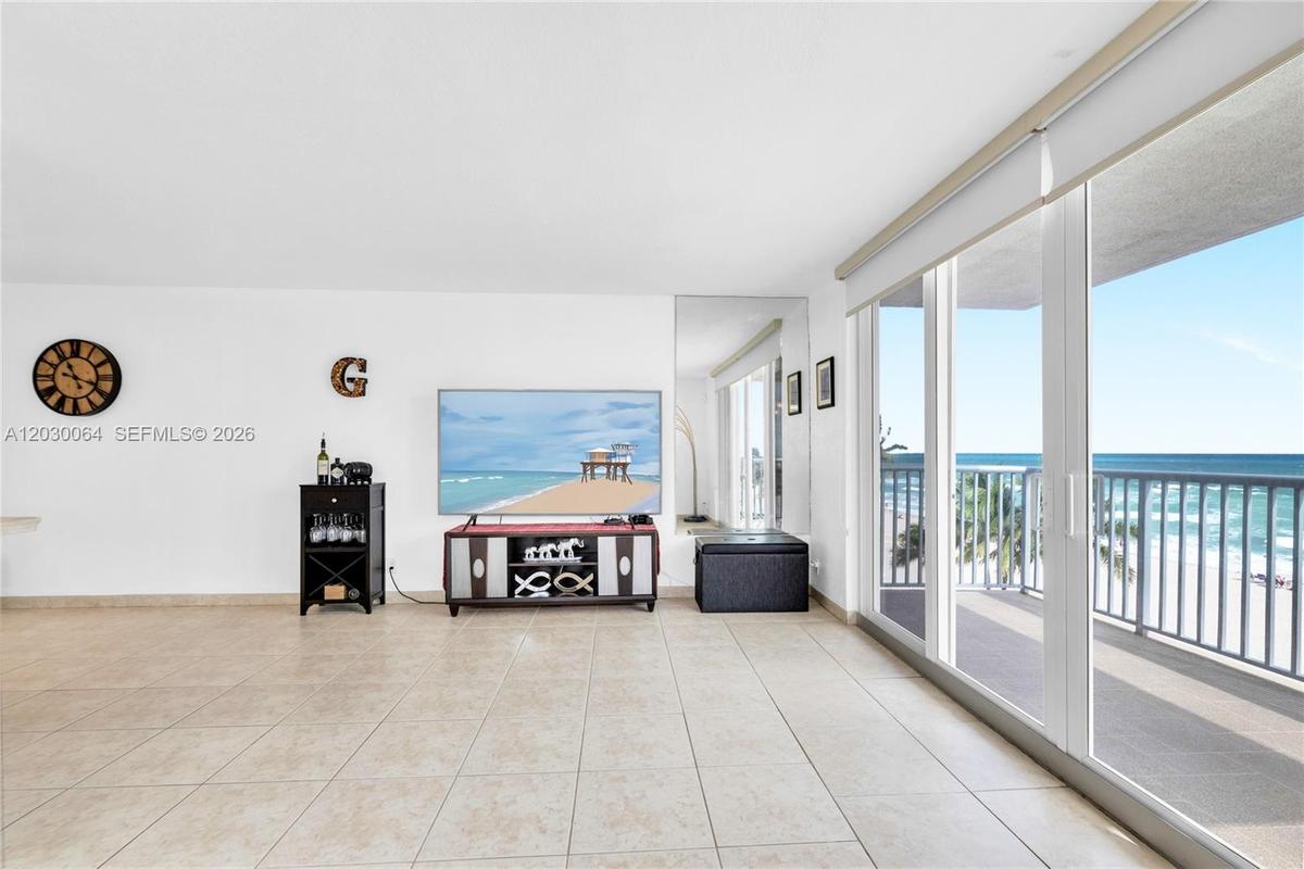 Ample living and dinning room . Impact windows