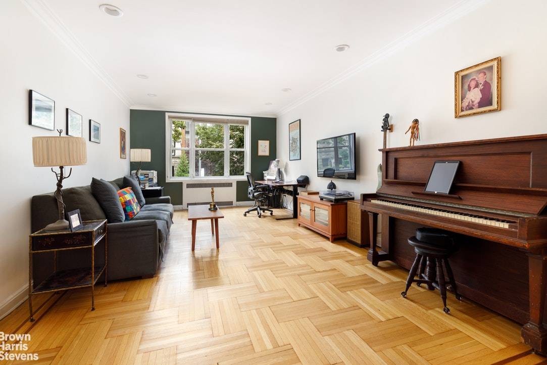 Welcome to this oversized, sunny and bright corner apartment directly across from Prospect Park.