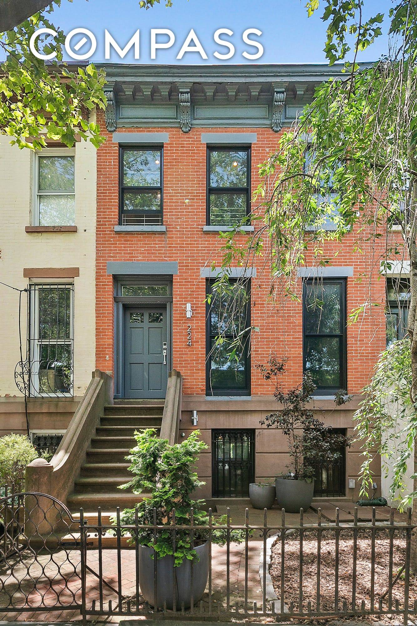 Harness your inner zen in this one of a kind brick townhouse with abundant outdoor space with a custom designed backyard.