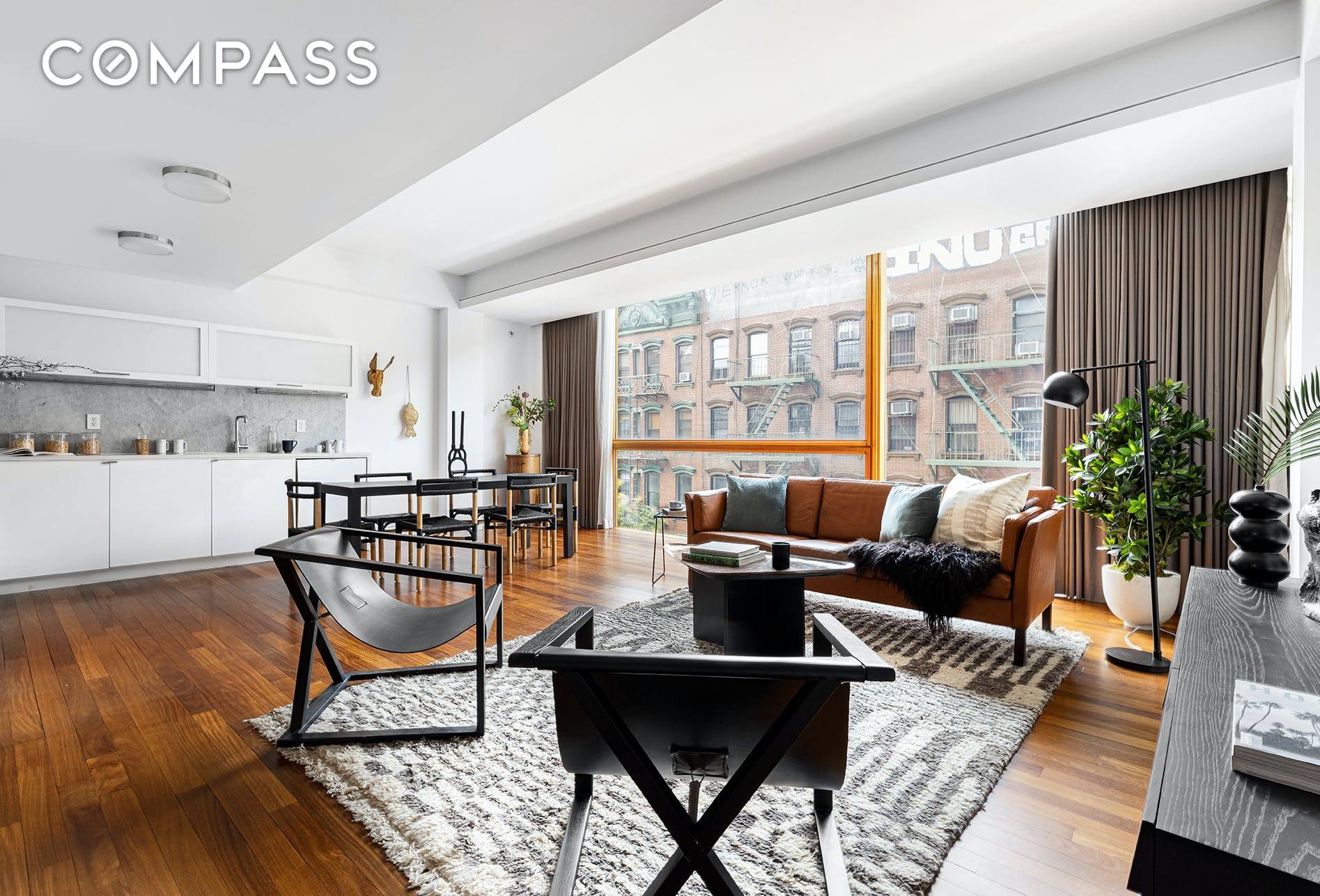 Chic full floor 1, 235 SF two bedroom, two bathroom condominium loft with a private balcony in the heart of the Lower East Side.