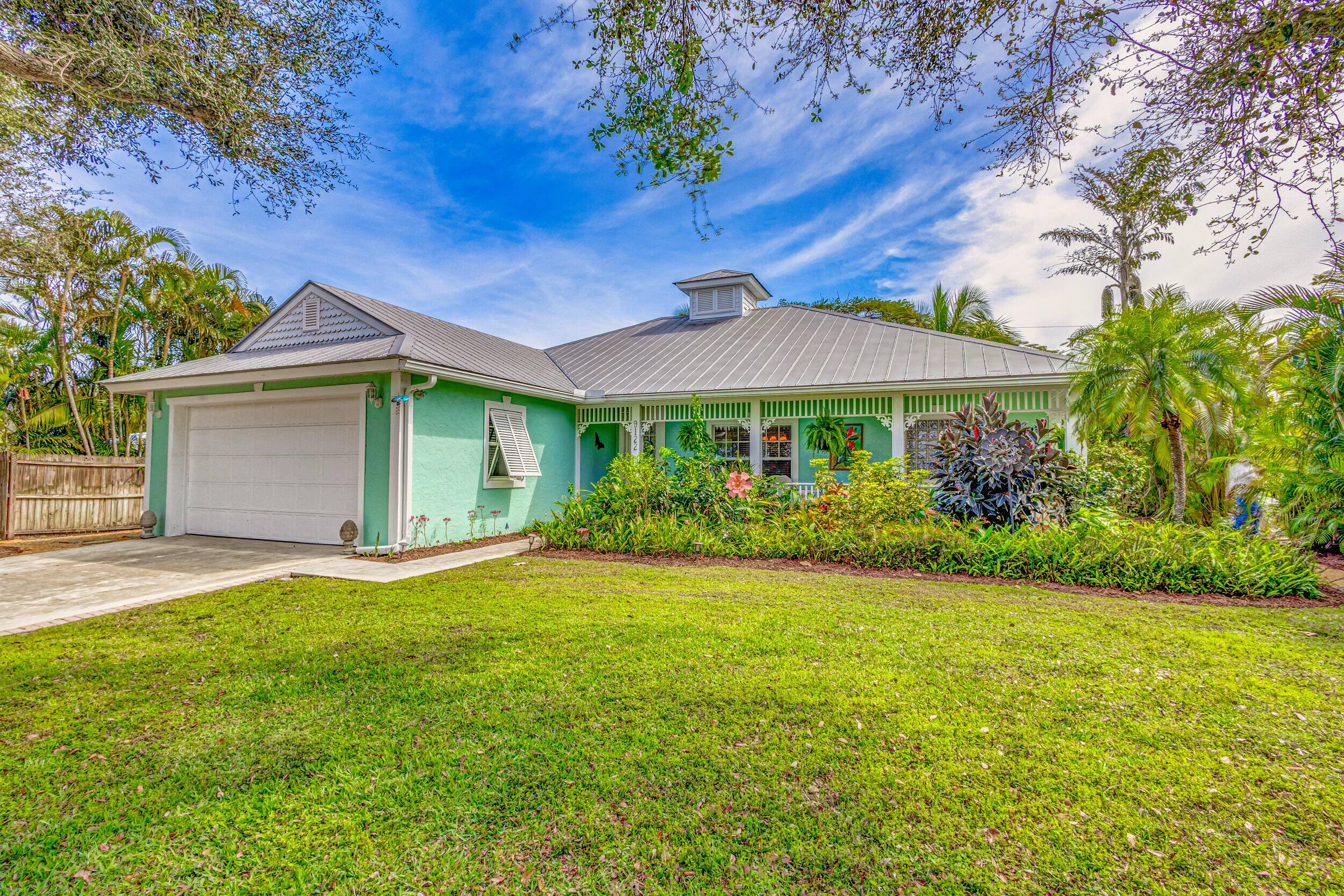 KEY WEST STYLE HOME 1 2 MILE TO BEACH WALK OR BIKE RIDE, ALSO 5 HOMES AWAY TO THE TENNIS, RACQUET, BASEBALL, BASKETBALL FEILDS AND PARK WITH NEARBY GROCERY STORES.