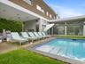 Outdoor pool featuring a patio