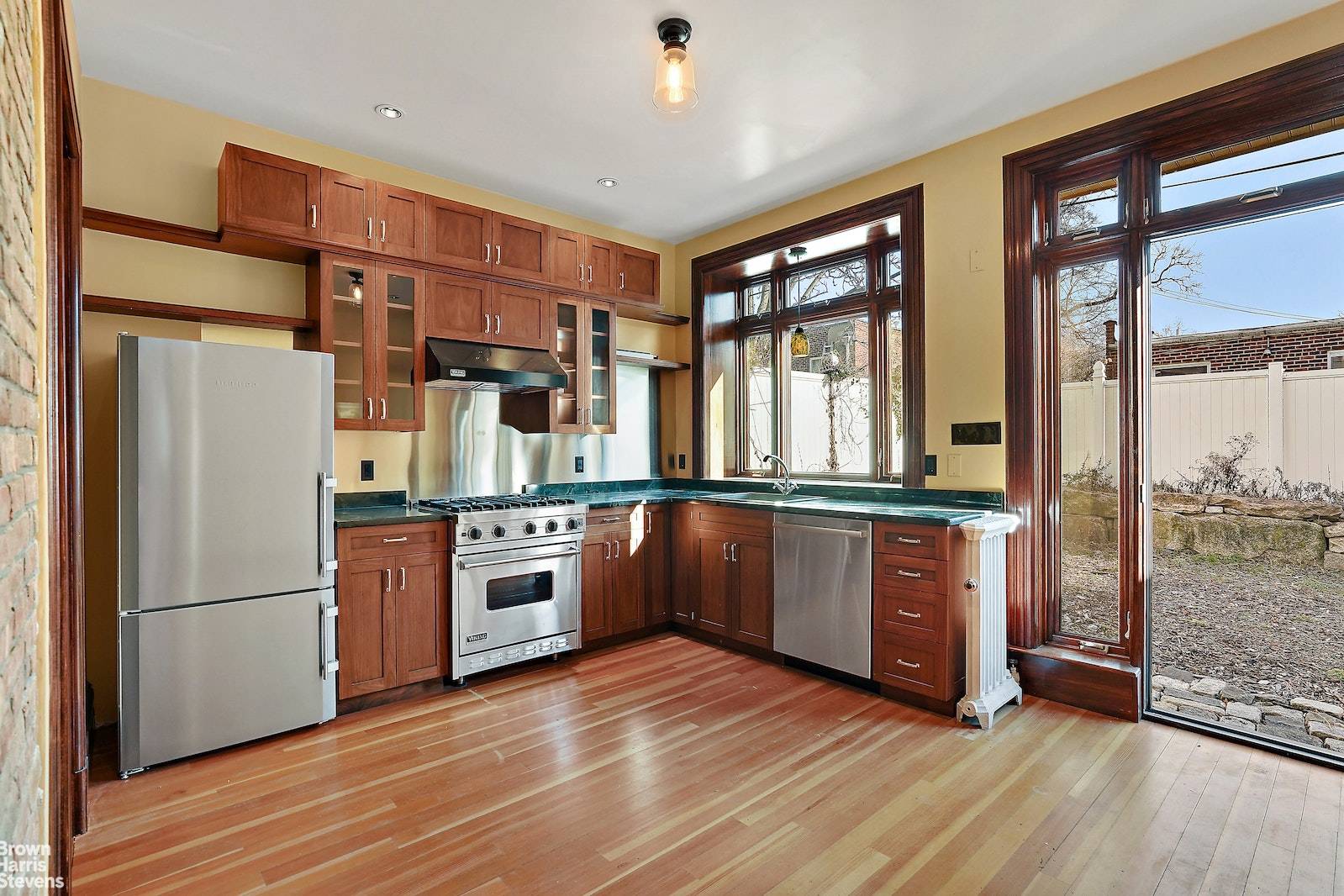 Old World Charm meets modern amenities in this exquisite turnkey Marble Hill Victorian house built in 1895.