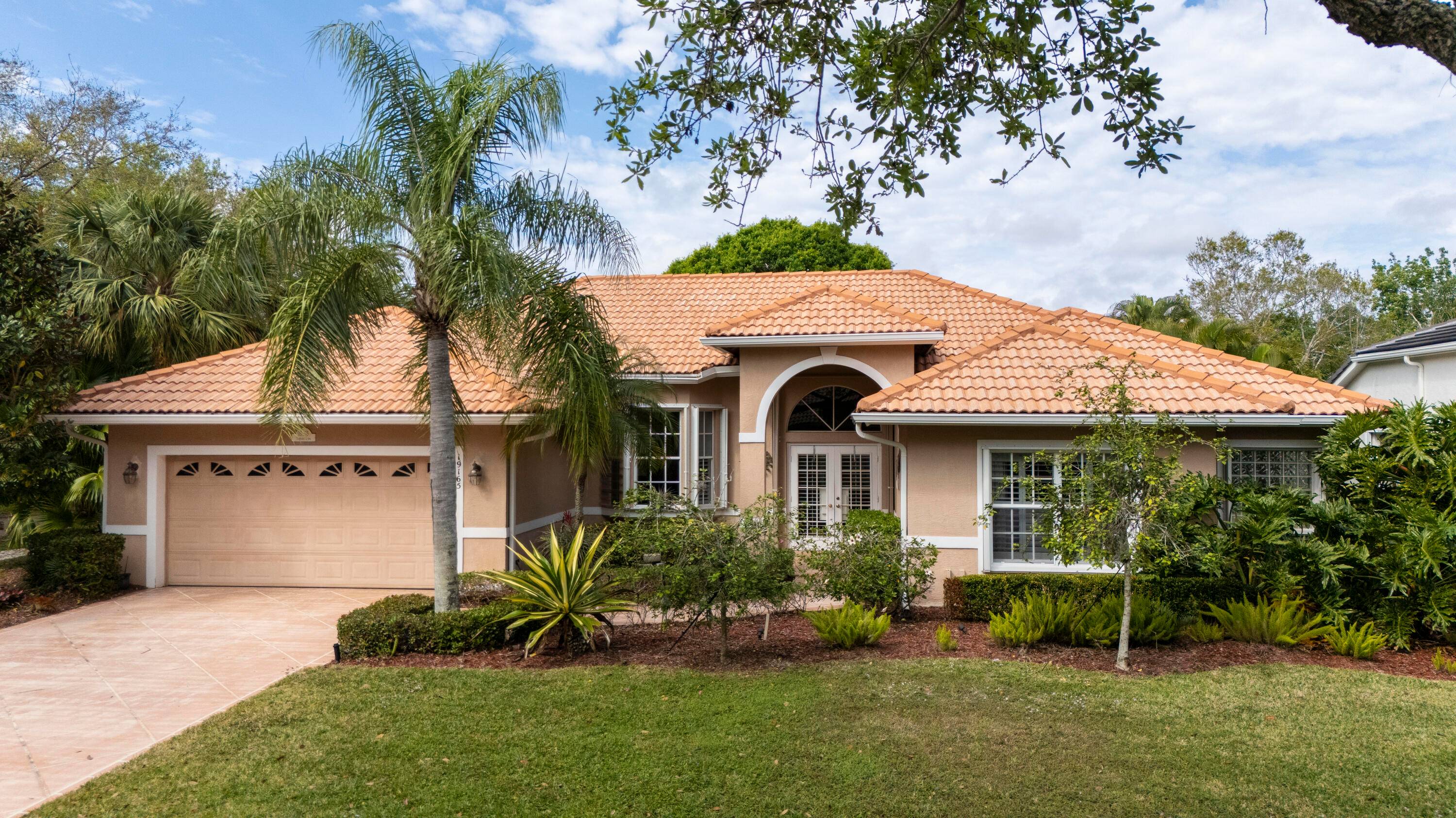 CORNER LOT BEAUTY in the Highly Desirable Gated Community of Cypress Cove Jupiter !