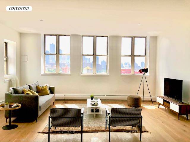 Rare Loft ! Renovated, top floor corner unit with huge terrace, open view, sunny southern and western exposure and in unit Bosch laundry.
