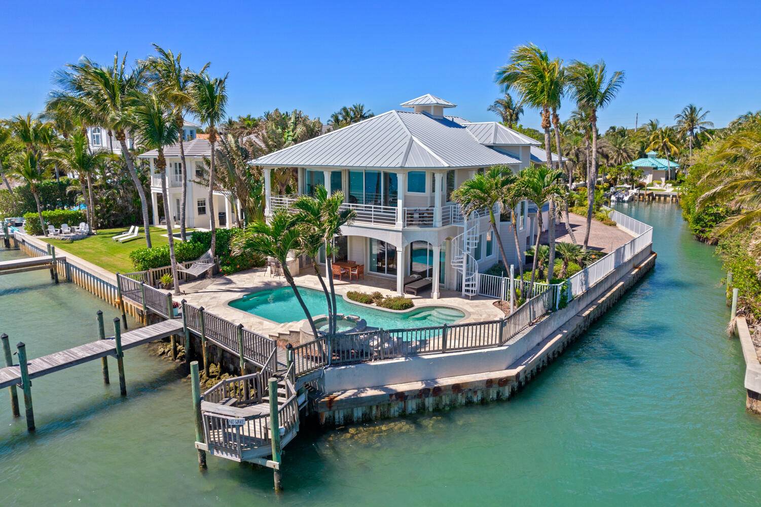 This extraordinary Key West style haven, zoned for commercial use, is a boater's dream property.