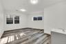 Spare room featuring wood finished floors and baseboards
