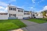 View of front of house with an attached garage and concrete driveway
