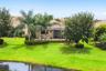 Lush, Landscaped Backyard with a Private Screened Pool