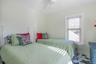 Bedroom with baseboards and ceiling fan