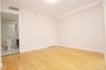 Unfurnished bedroom featuring light wood-style floors and baseboards