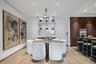 Dining area with light wood-style floors, recessed lighting, and an inviting chandelier