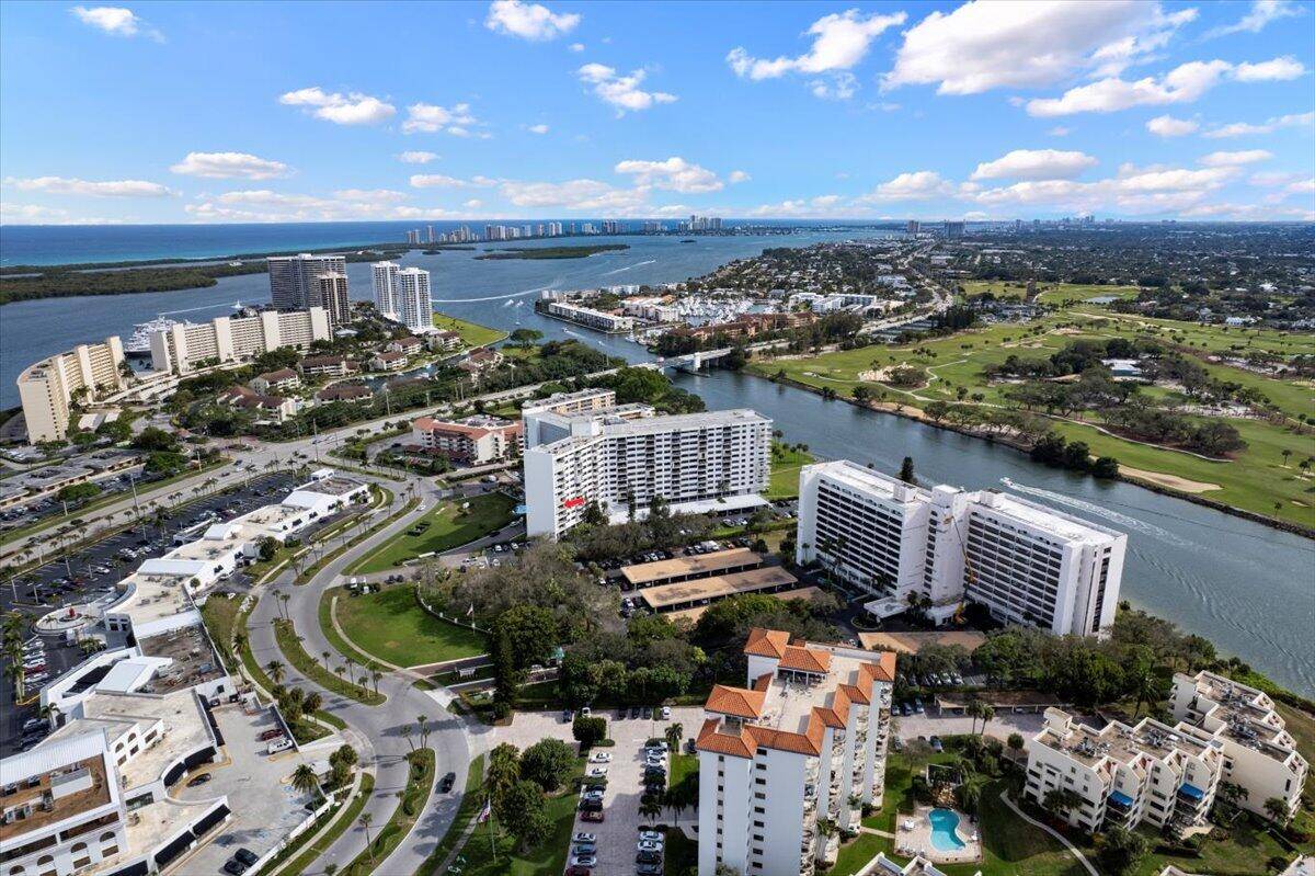 Rarely Available ! Not one, but two balconies overlooking the stunning Intracoastal Waterway and the renowned Jack Nicklaus Golf Course offering sunrise and sunset views.