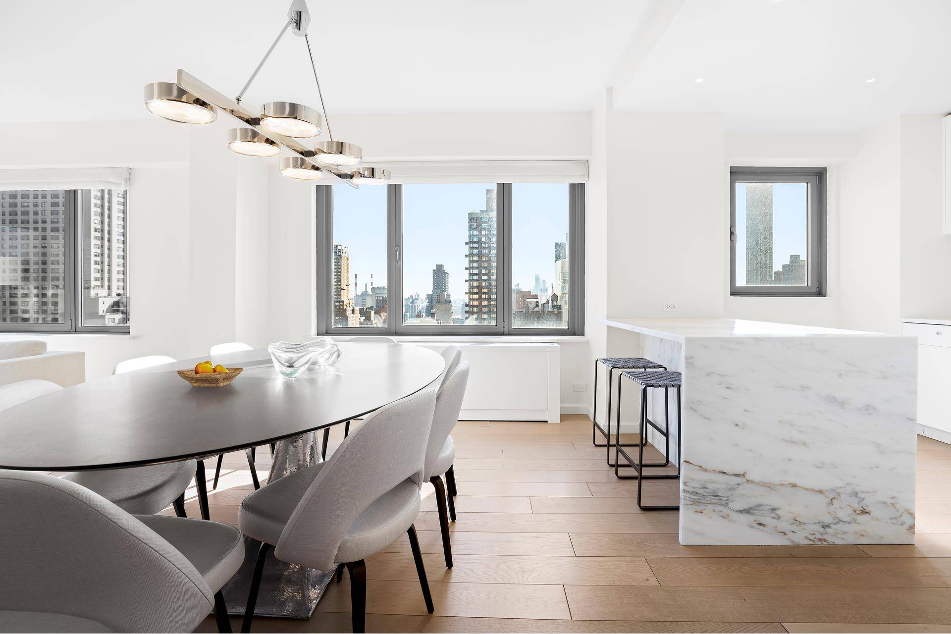 Sweeping views and unparalleled light illuminate this turnkey condominium home in prime Lenox Hill.