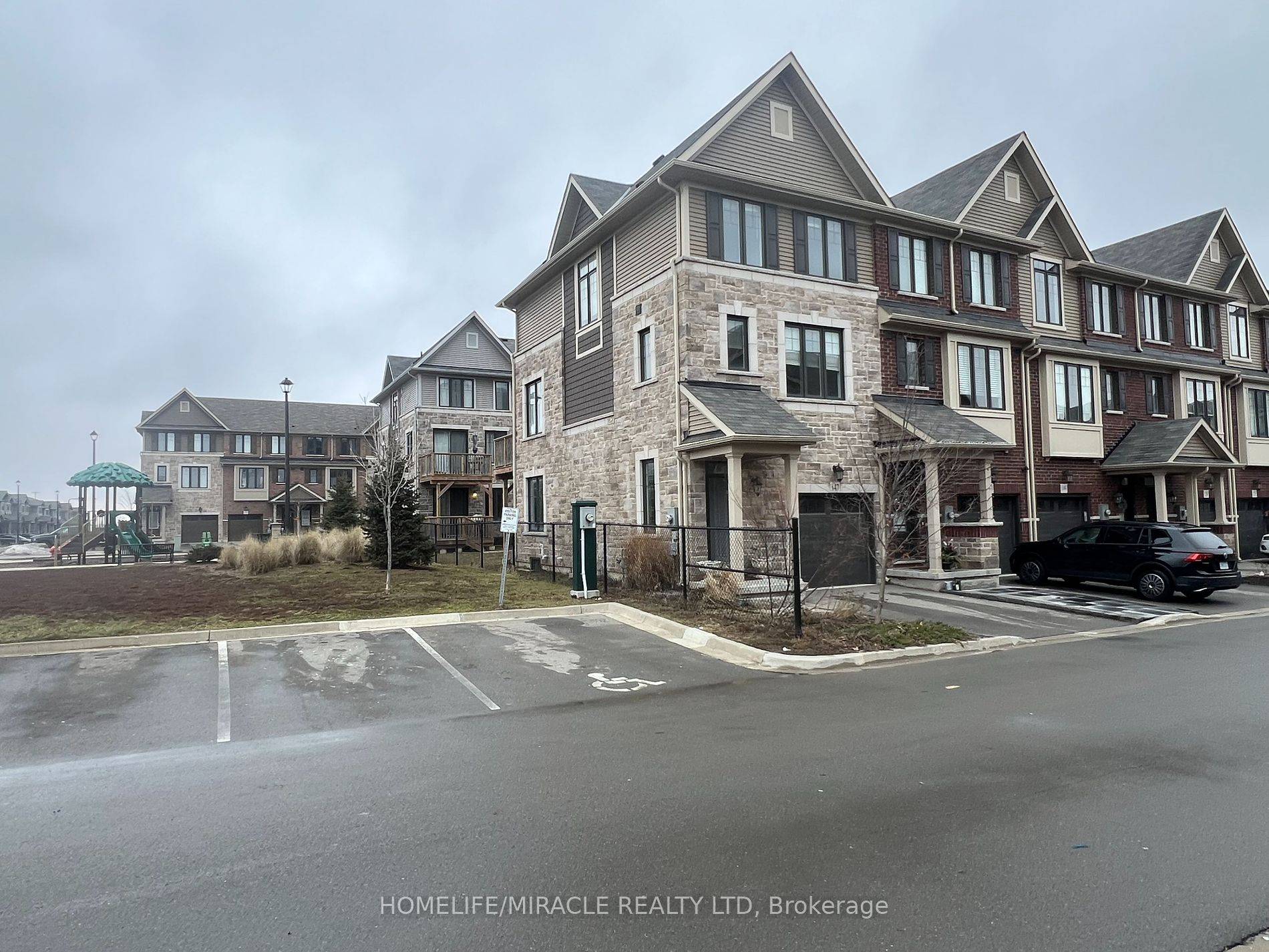 A Beautiful Freehold 3 Level Town Home corner unit like semi With 3 Bedrooms 3 Bathrooms.