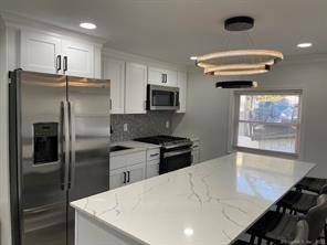 Completely remodeled. New Kitchen with quarts counters, new stainless steel appliances.