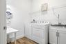 Spacious laundry room with room to sort, fold, and store with ease!