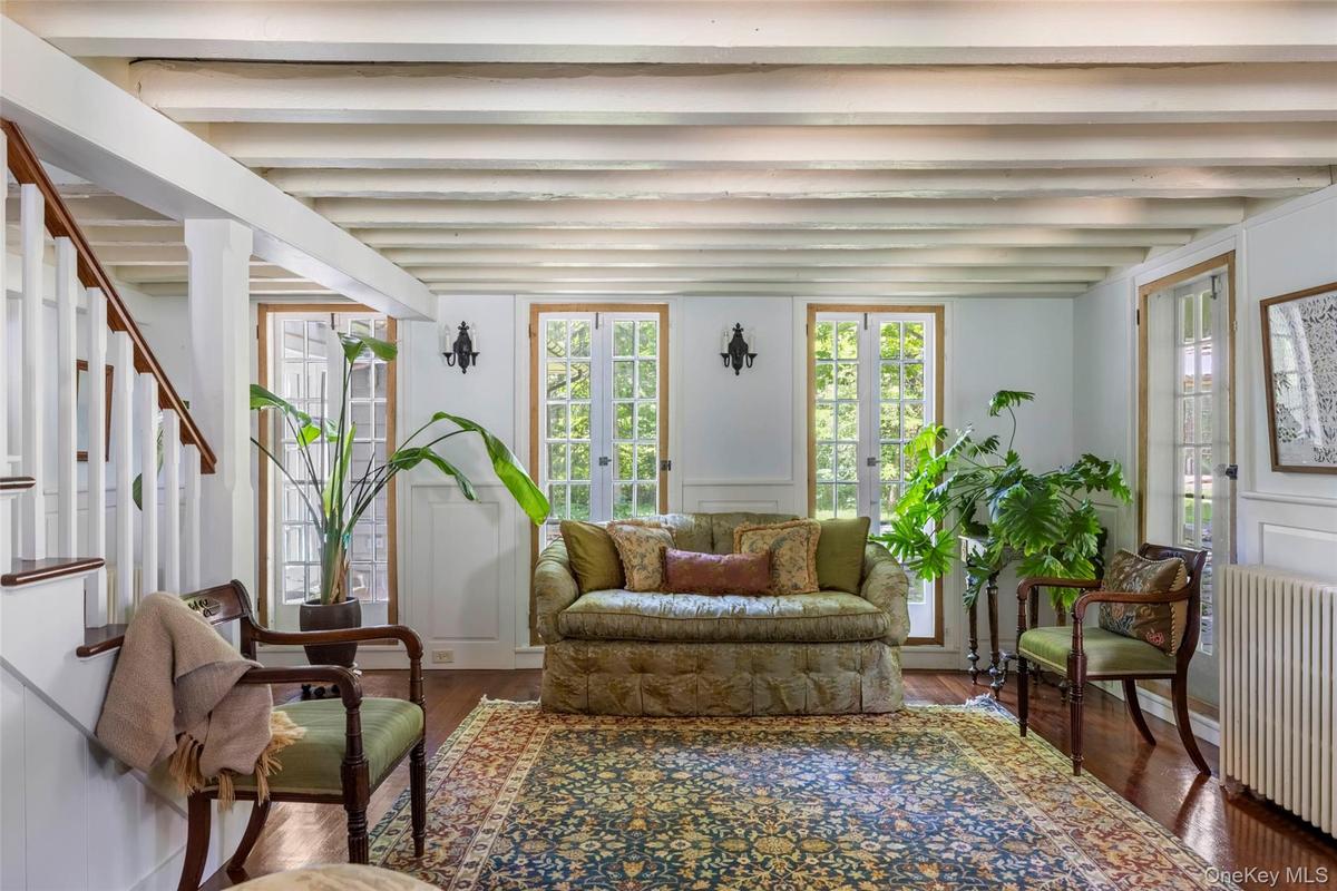 Surrounded by French doors opening to the gardens