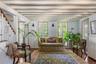 Surrounded by French doors opening to the gardens