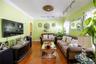 Living area featuring rail lighting, arched walkways, hardwood / wood-style floors, and crown molding
