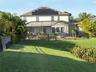 Backyard view of house close to the pond area