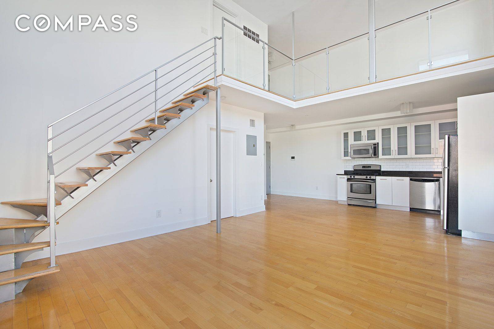 RARE Find ! This gorgeous corner duplex loft is configured as a 2 Bed 2 Bath home with floor to ceiling windows and 17 ft high ceilings.