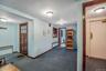 Hallway with carpet and radiator