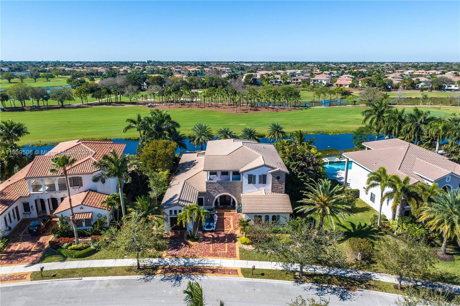 Unique estate property in Parkland Golf CC including 6 bedrooms, 4 full and 2 half bathrooms, and a sizable lot with views of the lake and fairway.