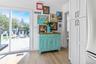 Doorway to outside featuring wood finished floors and baseboards