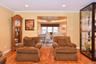 Living room featuring ornamental molding and light wood-type flooring