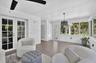 This room has plenty of space for a dining table/desk space, yoga area.. it's up to you!