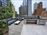 View of patio / terrace with exterior kitchen, an outdoor hangout area, and a city view