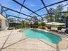 561 Harriswood Court heated pool with spa. Covered lanai with conservation view.