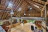 Vaulted ceilings, original timber framing and dramatic scale showcase the barn’s remarkable architectural character