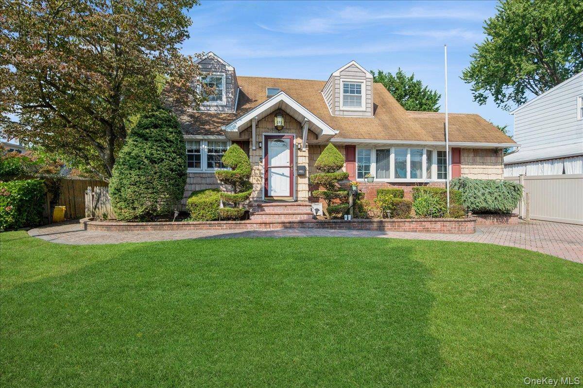 Welcome to 10 Nancy Lane, a delightful 3 bedroom 3 bath Cape perfectly sited mid block on a quiet street while conveniently located right in the heart of Hicksville.
