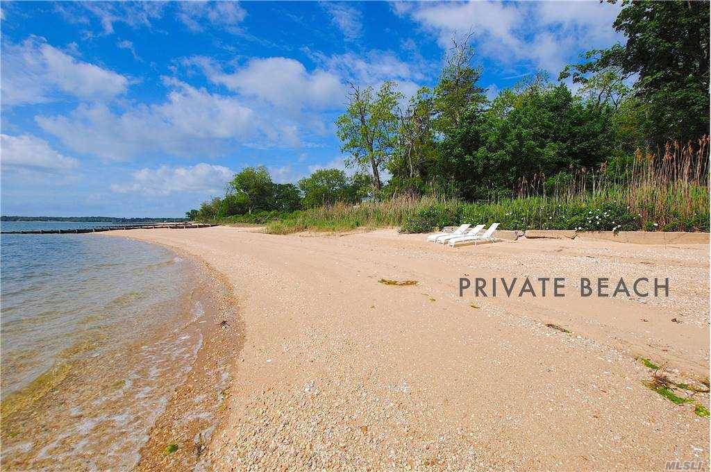 Southold Waterfront Home with large private sugar sand beach on the open bay.