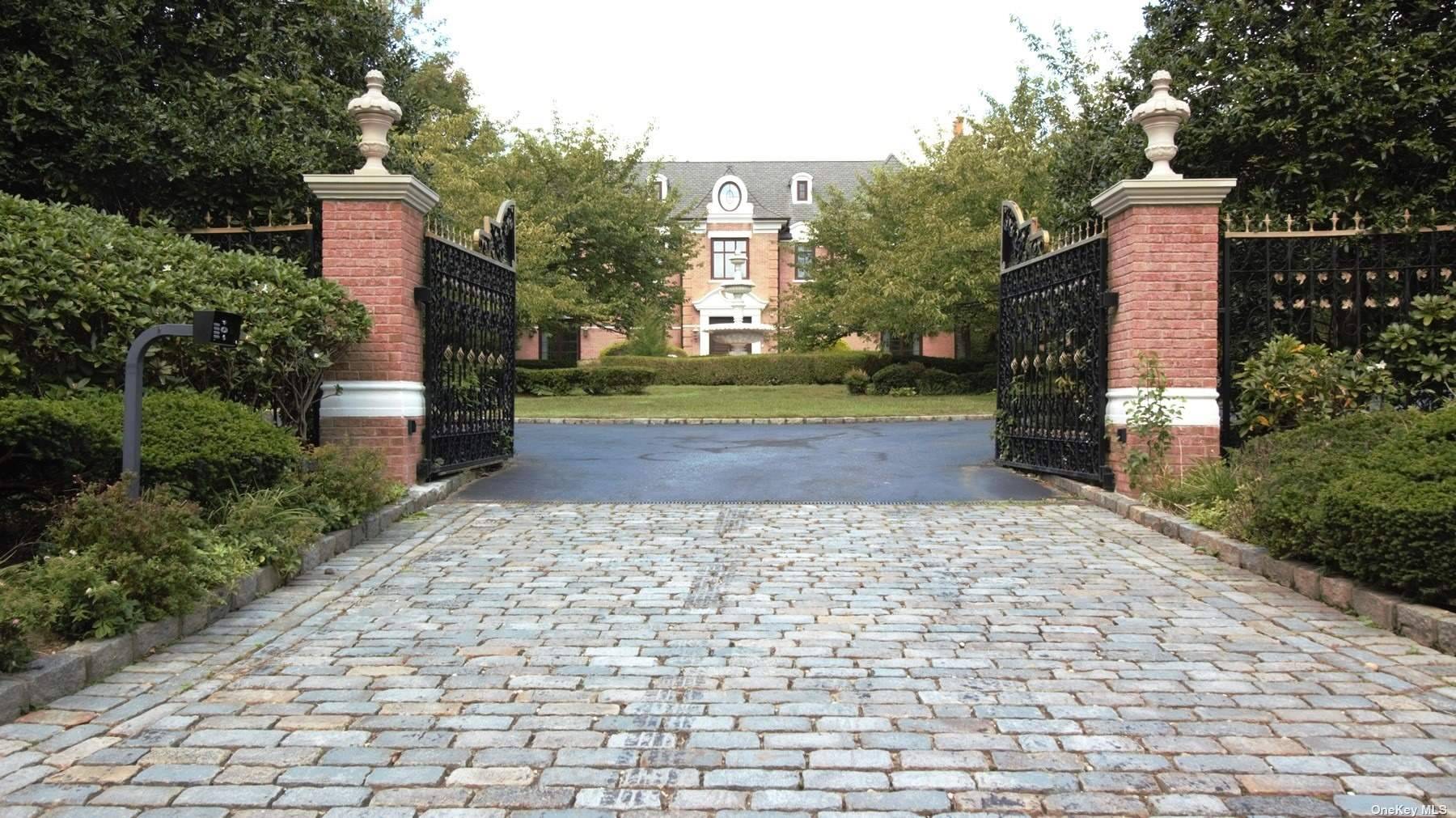 Magnificent gated entry leads you to a dramatic young Georgian Colonial situated on 4 acres on the most prestigious street in Old Westbury.